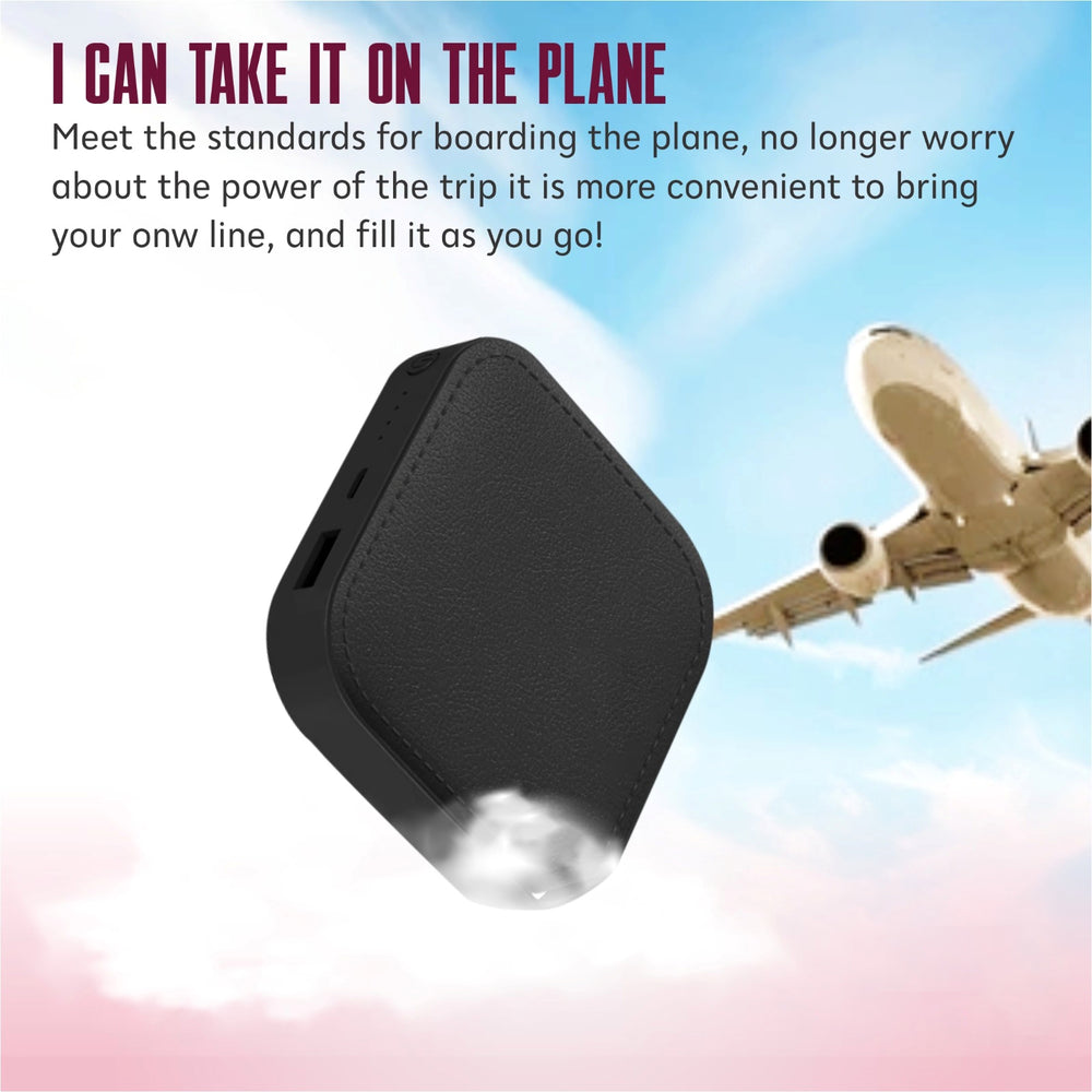 Black power bank with airplane in the background